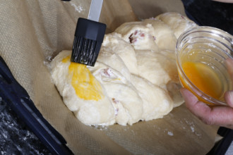 Swabian cuisine, preparation of savoury yeast plait with smoked meat, salty wreath bread, yeast