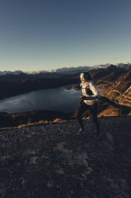 Trail running in autumn on the Jochberg on Lake Walchensee against the wonderful backdrop of the