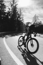 Road bike rider in spring between Lechtal and Tannheimer Tal in front of picturesque scenery of the