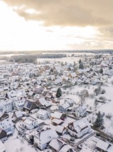 Snowy village with houses, under cloudy sky at sunset, Calw, Altburg, district Calw, Black Forest,