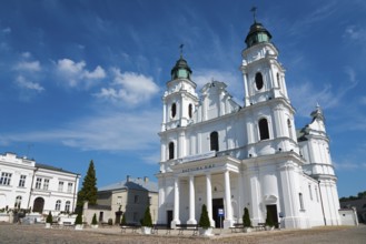 Historic white baroque-style church against a blue sky, Basilica of the Nativity of the Virgin