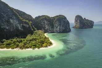 Steep karst cliffs and beach on the islands of Koh Lao Liang, Thailand, Asia