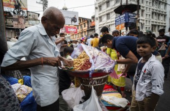 Crowd of people to shop at a street market ahead of Durga Puja festival on October 7, 2024 in