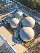 Aerial view of large industrial tank facilities in a snowy environment, Neubulach, Black Forest,