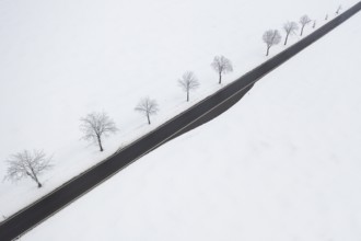 Aerial view of a straight country road in the snow, near Oederan, Saxony, Germany, Europe