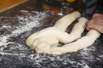 Swabian cuisine, preparation of savoury yeast plait with smoked meat, salty wreath bread, yeast