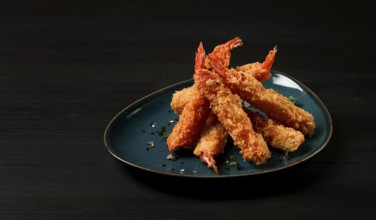 Fried shrimp, peeled in tempura, soy sauce, close-up