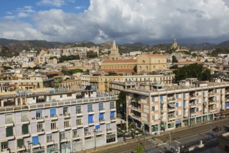 High angle view of Messina city skyline with storm clouds gathering in late summer, Sicily, Italy,