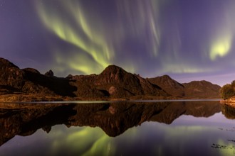 Northern Lights, Aurora borealis, mountains reflected in fjord, autumn, Vesteralen, Norway, Europe