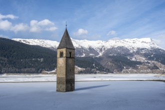 Church tower in Lake Reschen in winter, Reschen Pass, South Tyrol, Italy, Europe