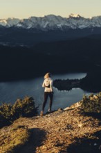 Trail running in autumn on the Jochberg on Lake Walchensee against the wonderful backdrop of the