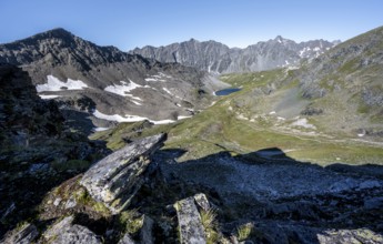 Mountain landscape with rocky mountain peaks, mountain basin with mountain lake Bödensee and