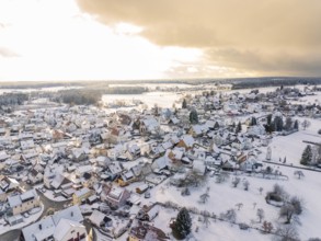 Snowy village in a wide landscape, dramatic clouds in the sky, Calw, Altburg, district of Calw,