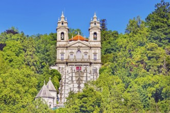 View of Bom Jesus do Monte santuary immersed in the greenery of the surrounding woods, Braga, Minho