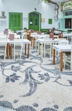 Traditional pebble mosaic adorning Mandraki old town, Mandraki, Nisyros Island, Dodecanese Islands,