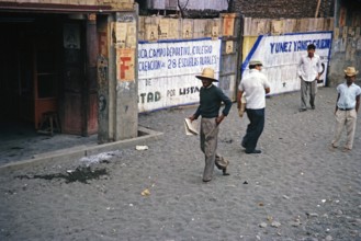 Main street in a town in the coastal plain, Ecuador, South America, 1962, location undetermined,