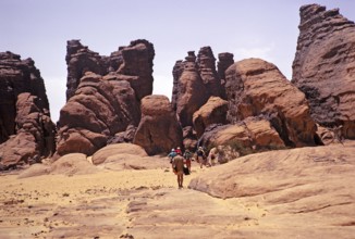 Tourists on their way to cave dwellings, Tassili N'Ajjer National Park, Algeria, North Africa 1973,