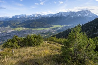 View of Garmisch-Partenkirchen and mountain panorama with Wetterstein mountains, hike to