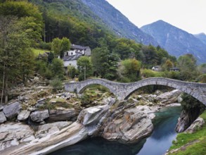 Historic Ponte dei Salti with double arches, Roman bridge, over the Verzasca river, Verzasca