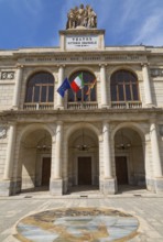 Vittorio Emanuele Theatre building facade with three arched entrance and 1908-2008 commemorative