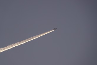 Aeroplane with contrails, Germany, Europe