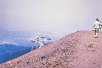 People walk on crater of Mount Vesuvius volcano, Naples, Campania, Italy, Europe 1967, Europe