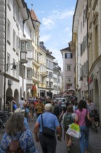 Bolzano, South Tyrol, Italy, Passers-by stroll through the Laubengasse in the old town centre,