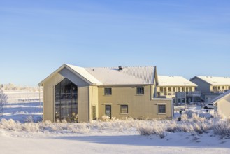 New build residential area with detached houses on a cold snowy winter day in sunshine, Falköping,