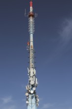 Mobile phone communications tower with antennas against blue sky, Mount Srd, Dubrovnik, Croatia,