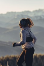 Trail running in autumn on the Jochberg on Lake Walchensee against the wonderful backdrop of the