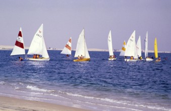 Leisure activities of foreign workers sailing on Wayfarer dinghies, Half Moon Bay, Saudi Arabia