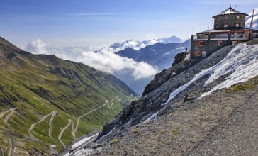 View to the left steep mountain wall with 2758 metres high highest pass road in Italy with narrow