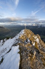 Summit cross at the summit of the Kramerspitz, at sunset, in autumn, Ammergau Alps, in autumn,