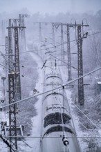 Winter weather, heavy snowfall, railway tracks in front of Essen main station, ICE train, North