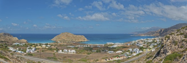 Expansive coastal view of Arkasa with blue sea and hilly islands, Arkasa, Karpathos, Greece, Europe