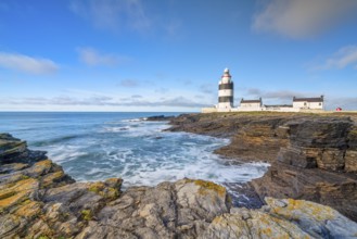 Hook Head lighthouse, blue sky and spray, Wexford, Ireland, Europe