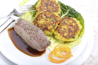 Swabian cuisine, medallions of wild boar with savoy cabbage cakes, meat dish, roasted, hearty, home