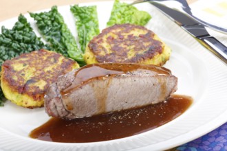 Swabian cuisine, medallions of wild boar with savoy cabbage cakes, meat dish, roasted, hearty, home