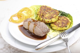 Swabian cuisine, medallions of wild boar with savoy cabbage cakes, meat dish, roasted, hearty, home