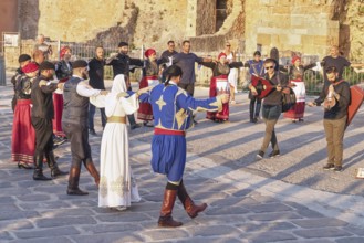 Group of people performing traditional Greek dance, Chania, Crete, Greek Islands, Greece, Europe