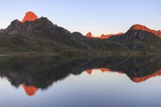 Mountains reflected in fjord, morning light, sunny, autumn, Annfjord, Vesteralen, Norway, Europe