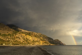 A thunderstorm with rainbow on the beach of Sougia in the south of Crete, Greece, Europe