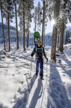 Snowshoe hiker in snowy winter forest, Sonnenstern, Ascent to Teufelstättkopf, Snowy mountain