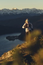 Trail running in autumn on the Jochberg on Lake Walchensee against the wonderful backdrop of the