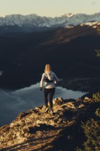 Trail running in autumn on the Jochberg on Lake Walchensee against the wonderful backdrop of the