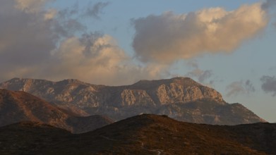 A mountain landscape at sunrise with clouds and blue sky, Morning mountain landscape, Karpathos,