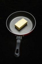 A knob of butter in a pan