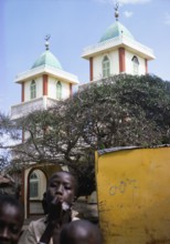 Towers of an Islamic mosque with children, Ngor village, Dakar, Senegal, Africa 1978, Africa