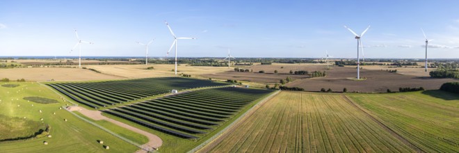 Wind farm and solar cells renewable energy wind power wind energy on the Baltic Sea aerial view