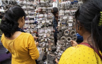 Women buys jewelleries at street market ahead of Durga Puja festival on October 7, 2024 in